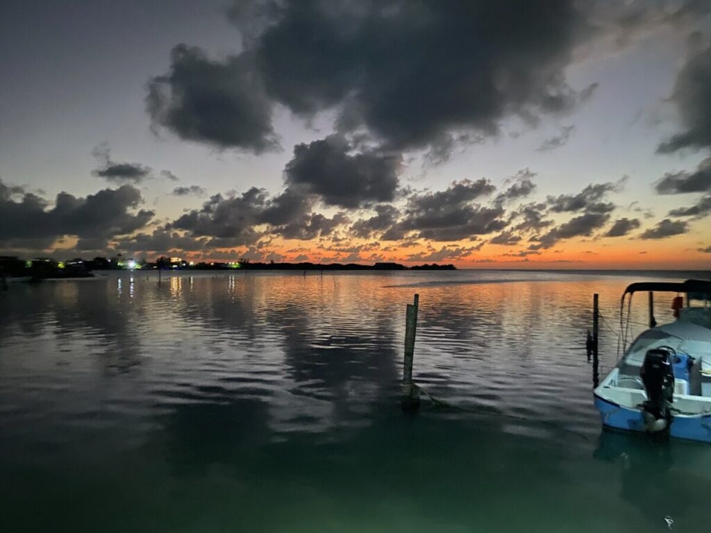 Pelican Sunset Bar view of the water and the clouds, with the sunsetting