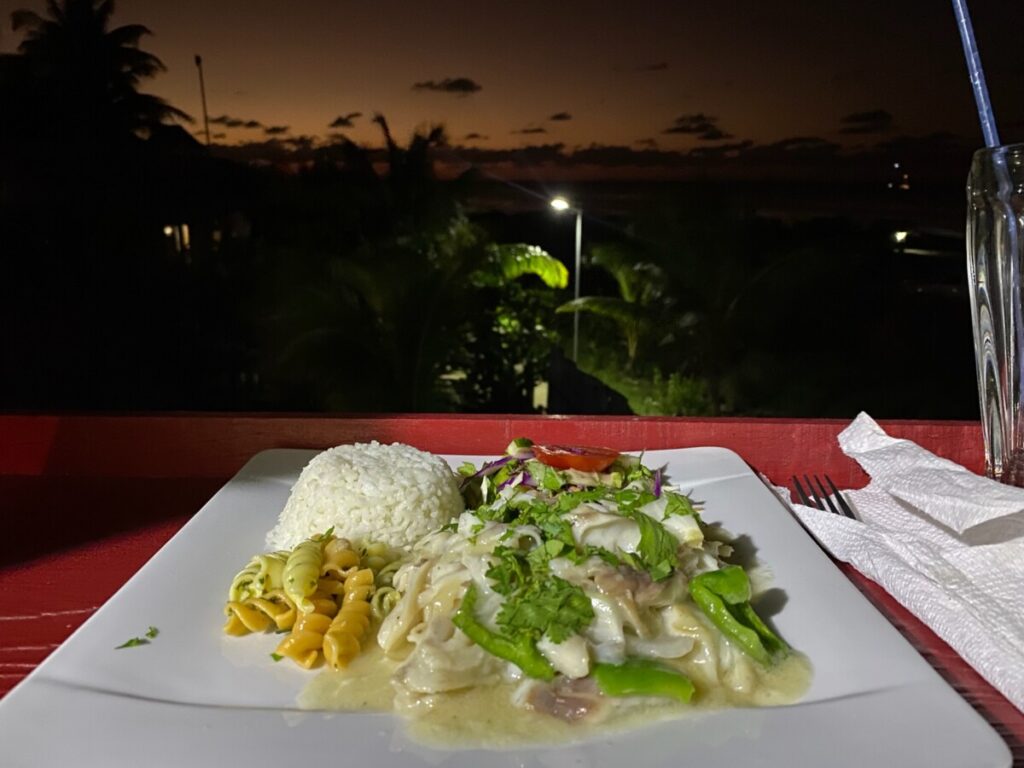 The coconut fish with rice and vegetables at Elba's Restaurant