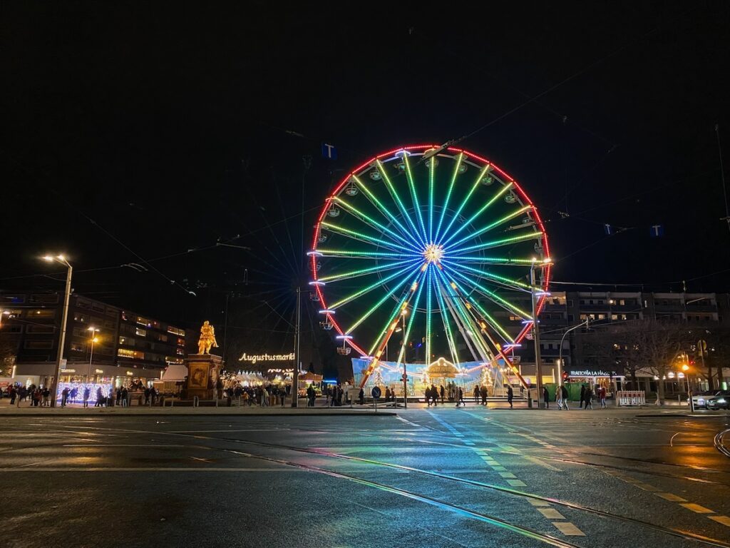 Ferris wheel lit up at night at the Augustusmarkt, Dresden