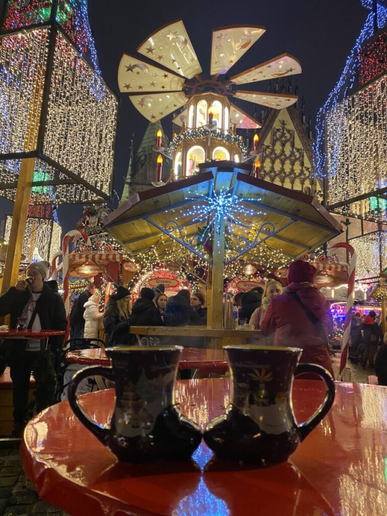 Gluhwein with Christmas decor in background