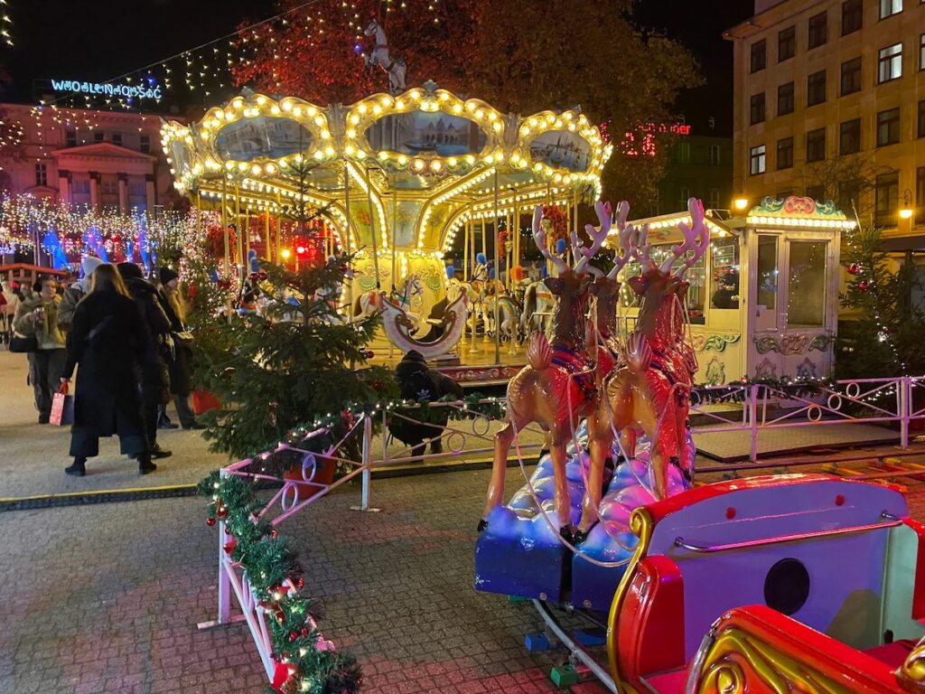 Poznan merry go round and other rides at the market