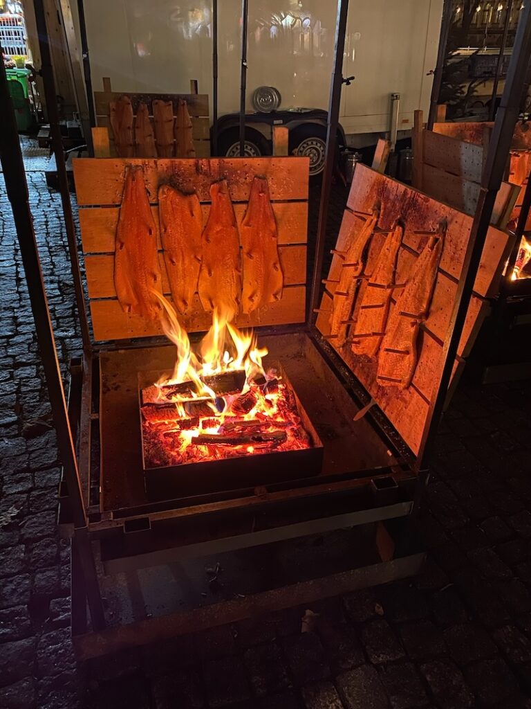 Salmon cooking with the wood flame at the Finnish Christmas market